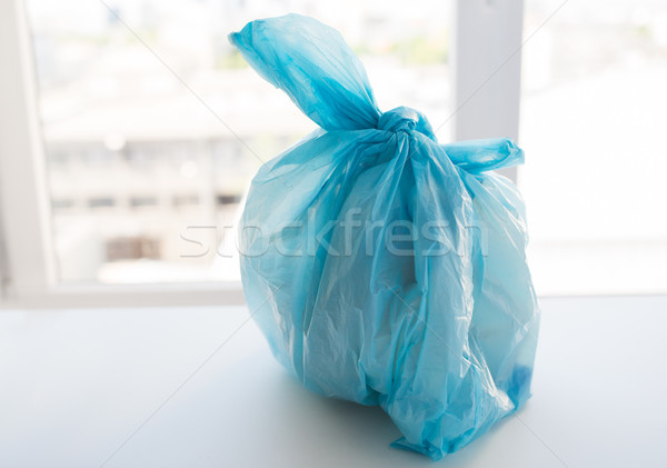 Stock photo: close up of rubbish bag with trash at home