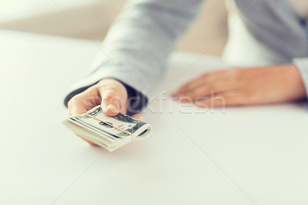close up of woman hands holding us dollar money Stock photo © dolgachov