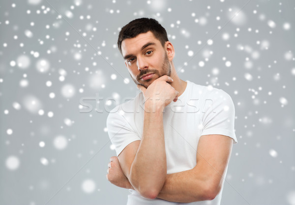 man thinking over snow background Stock photo © dolgachov