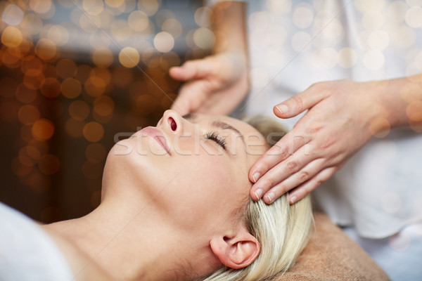 close up of woman having face massage in spa Stock photo © dolgachov