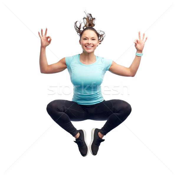 Stok fotoğraf: Mutlu · gülen · genç · kadın · atlama · hava