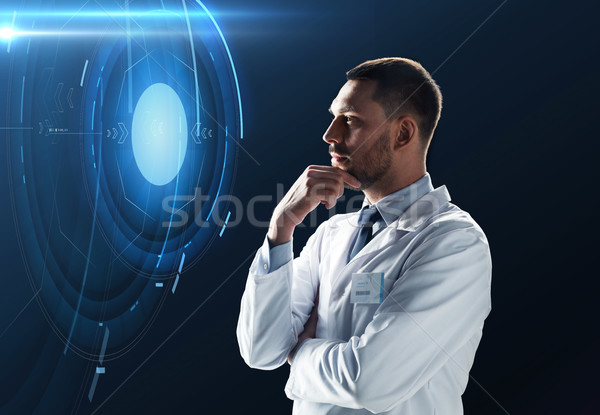 doctor or scientist with virtual projection Stock photo © dolgachov