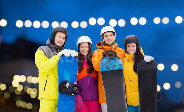 happy friends in helmets with snowboards Stock photo © dolgachov