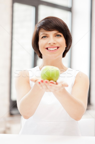 lovely housewife with green apple Stock photo © dolgachov