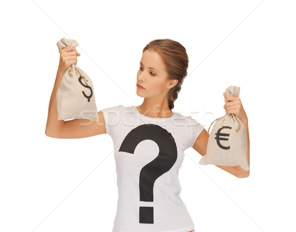 Stock photo: woman with dollar and euro signed bags