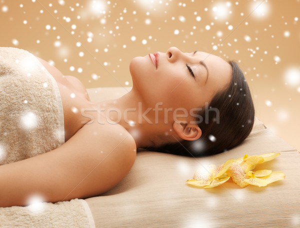 woman in spa salon lying on the massage desk Stock photo © dolgachov