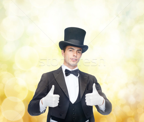 magician in top hat showing thumbs up Stock photo © dolgachov