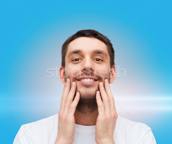 Stockfoto: Mooie · glimlachend · man · aanraken · gezicht · gezondheid