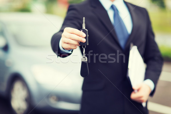 Stock photo: man with car key outside