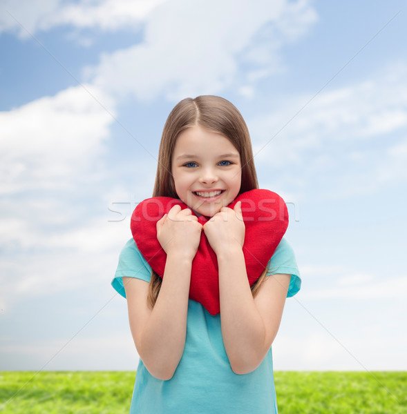 Mosolyog kislány piros szív szeretet boldogság Stock fotó © dolgachov