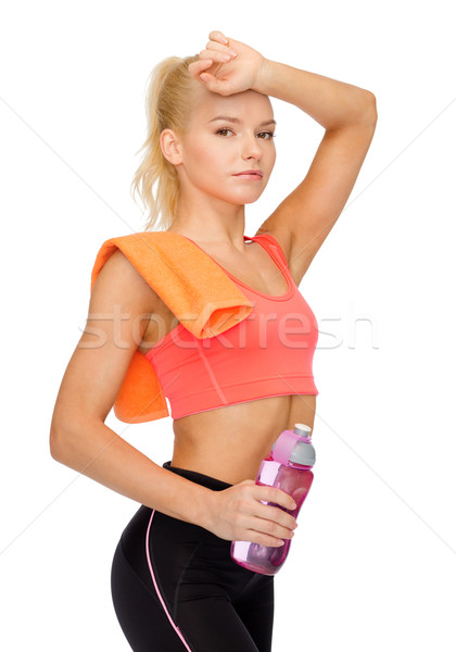 Cansado mulher toalha garrafa de água esportes Foto stock © dolgachov