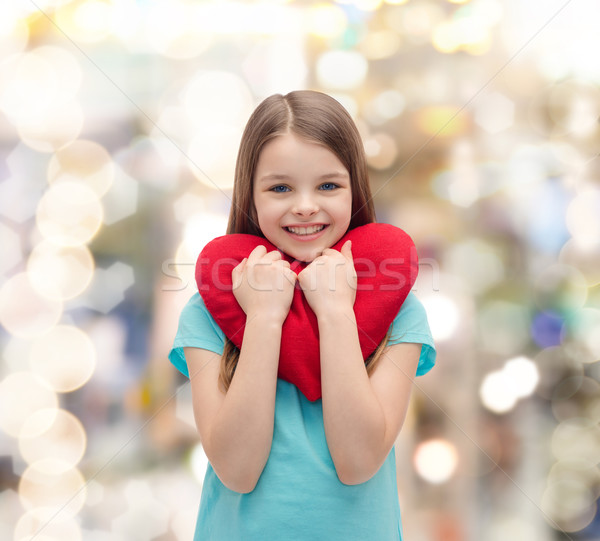 Mosolyog kislány piros szív szeretet boldogság Stock fotó © dolgachov