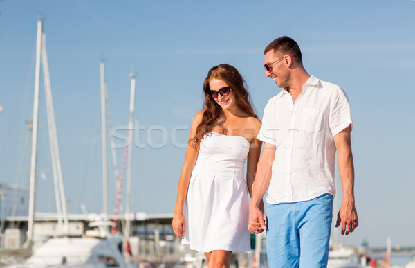 smiling couple in city Stock photo © dolgachov