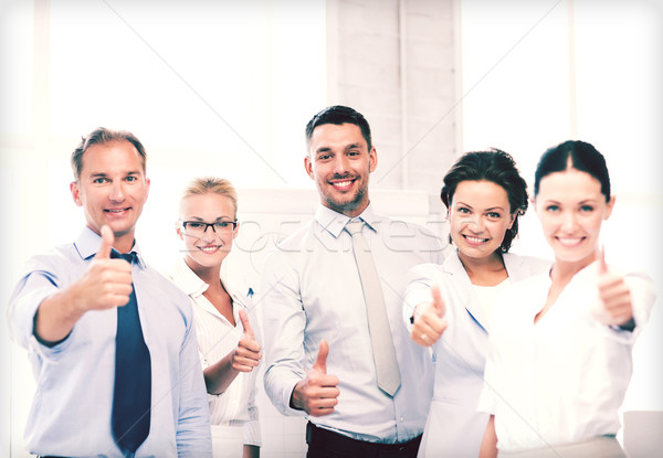 business team showing thumbs up in office Stock photo © dolgachov