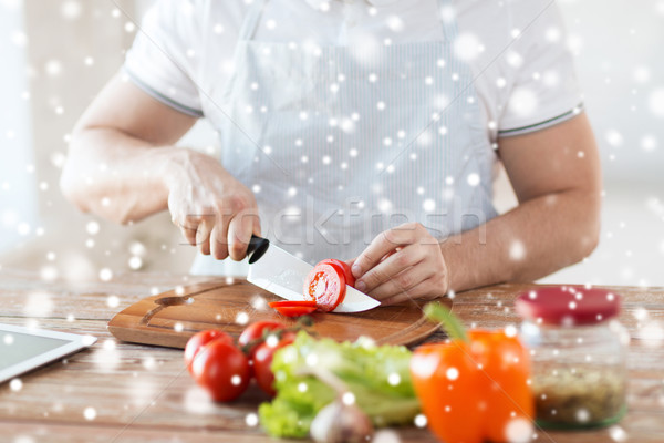 close up of man cutting vegetables with knife Stock photo © dolgachov