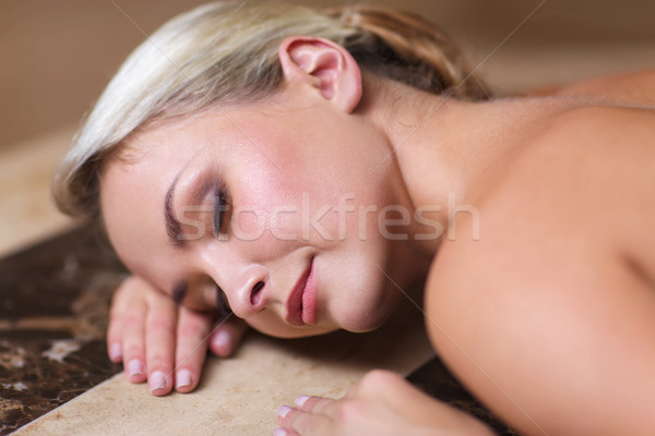 young woman lying on hammam table in turkish bath Stock photo © dolgachov