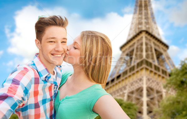 happy couple taking selfie over eiffel tower Stock photo © dolgachov