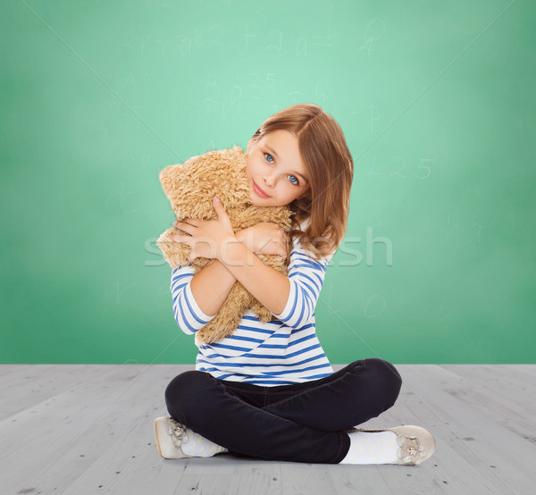 cute little girl hugging teddy bear Stock photo © dolgachov