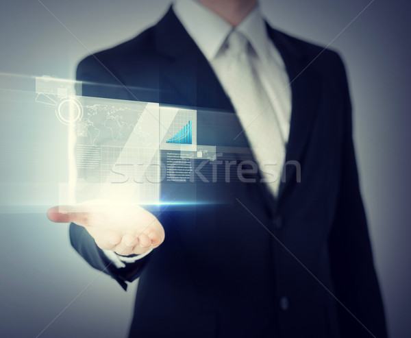 businessman hand showing chart on virtual screen Stock photo © dolgachov