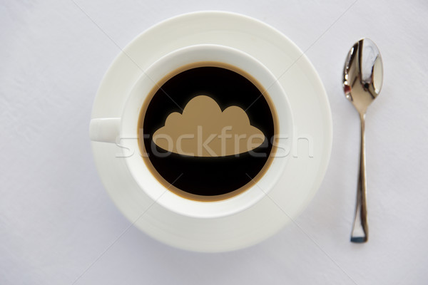 cup of coffee with cloud silhouette and spoon Stock photo © dolgachov
