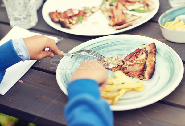 close up of child hands having dinner outdoors Stock photo © dolgachov