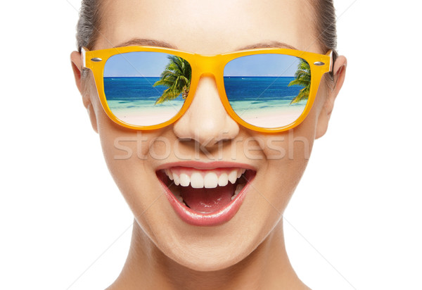 amazed girl in shades Stock photo © dolgachov