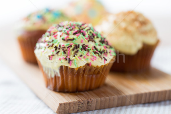 close up of glazed cupcakes or muffins on table Stock photo © dolgachov