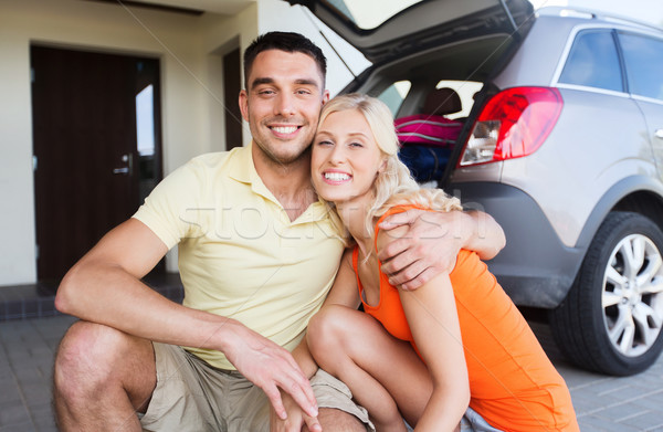 happy couple hugging at home car parking space Stock photo © dolgachov