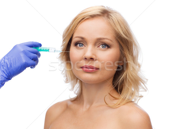 Vrouw gezicht hand spuit schoonheid cosmetische chirurgie handschoen Stockfoto © dolgachov