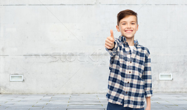 smiling boy in checkered shirt showing thumbs up Stock photo © dolgachov