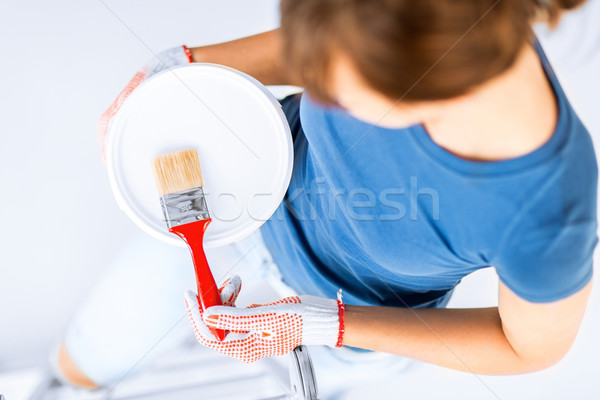 woman with paintbrush and paint pot Stock photo © dolgachov