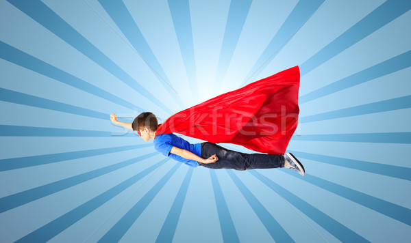 Erkek kırmızı süper kahraman maske uçan hava Stok fotoğraf © dolgachov