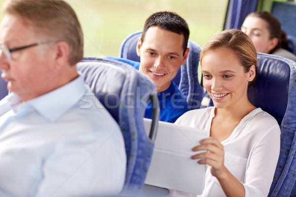 happy couple with tablet pc in travel bus Stock photo © dolgachov