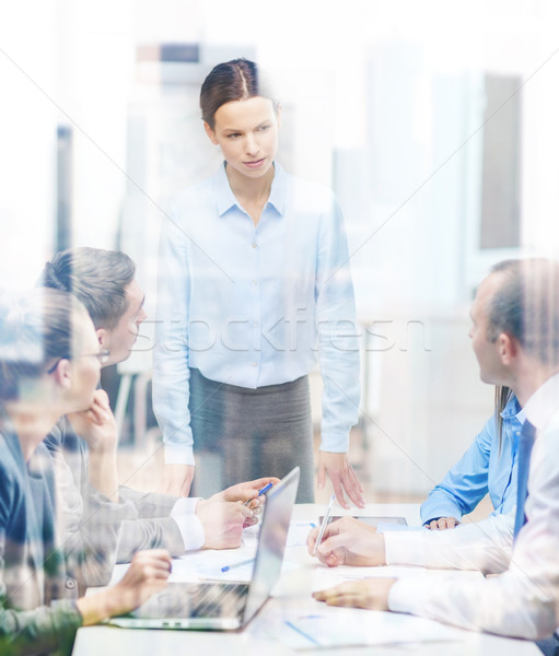 strict female boss talking to business team Stock photo © dolgachov