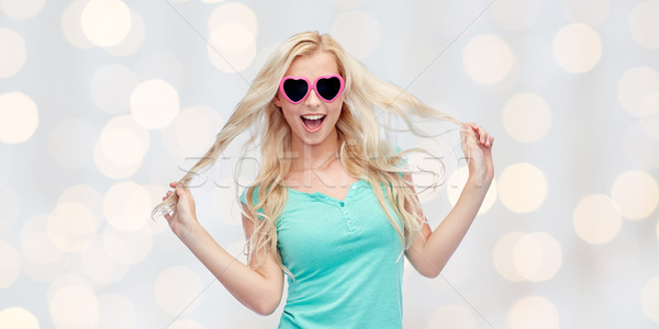 Stock photo: happy young blonde woman or teenager in sunglasses