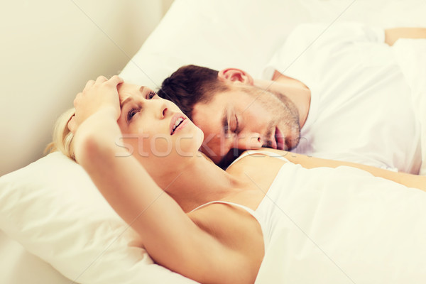 Stock photo: couple sleeping in bed at home