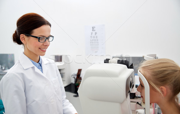 Stock photo: optician with tonometer and patient at eye clinic