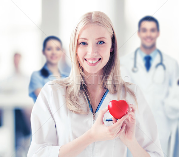 female doctor with heart Stock photo © dolgachov