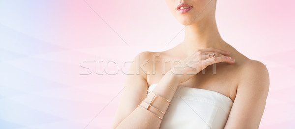 close up of beautiful woman with ring and bracelet Stock photo © dolgachov