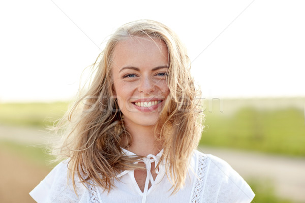 close up of happy young woman in white outdoors Stock photo © dolgachov