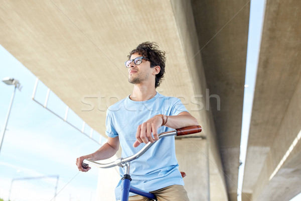 Jeunes homme équitation fixé engins [[stock_photo]] © dolgachov