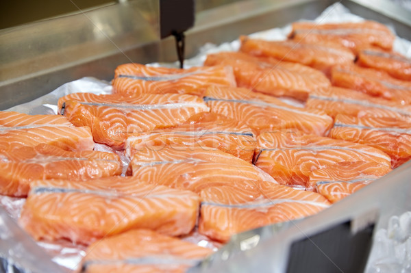 salmon fish at food market stall Stock photo © dolgachov
