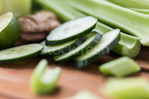 close up of celery stems and sliced cucumber Stock photo © dolgachov