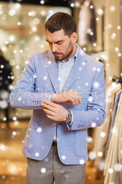 Jeune homme veste vêtements magasin vente Shopping [[stock_photo]] © dolgachov