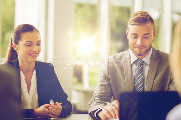 smiling business people meeting in office Stock photo © dolgachov