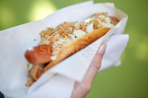 close up of hand with hot dog Stock photo © dolgachov