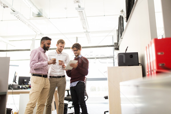 business team with tablet pc and coffee at office Stock photo © dolgachov