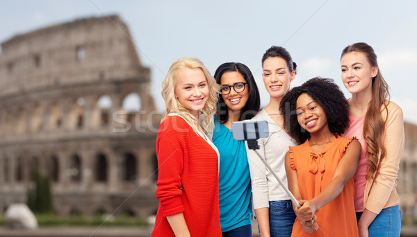 international women taking selfie over coliseum Stock photo © dolgachov
