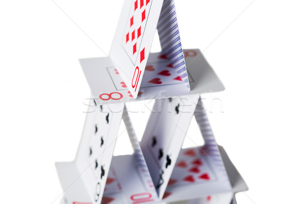 house of playing cards over white background Stock photo © dolgachov