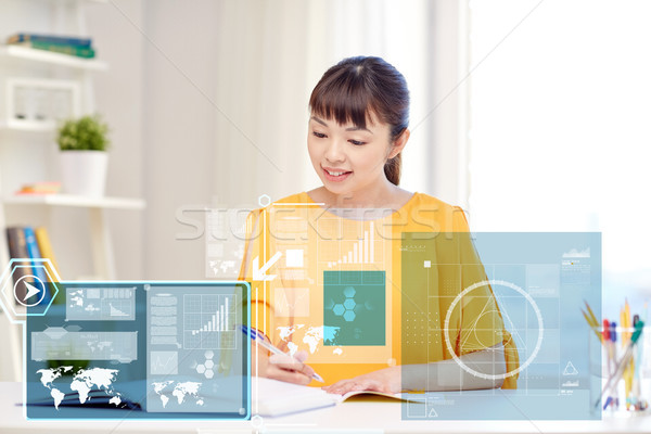 Stock photo: happy asian young woman student learning at home